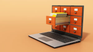 File cabinets or catalogue drawers inside the laptop screen. Folders standing inside the drawer.